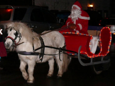 Santa arriving in stylish sled at The Butchers Arms