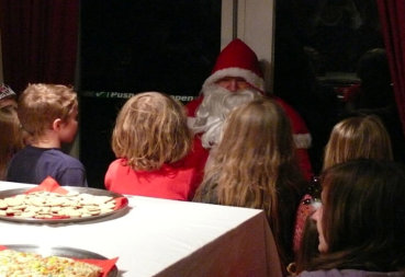 Santa chatting with children